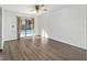 Living room featuring a sliding glass door to a private pool area at 5640 Se 21St Ln, Ocala, FL 34480