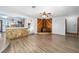 Open-concept living room featuring a stone accent wall and a unique wood-burning fireplace at 5640 Se 21St Ln, Ocala, FL 34480