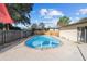 Backyard view of the in-ground pool, and the privacy fence in the background at 5640 Se 21St Ln, Ocala, FL 34480