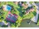 Aerial view of the community featuring a pool, tennis courts, and lake access, showcasing the amenities and natural surroundings at 624 Maple Oak Cir # 108, Altamonte Springs, FL 32701