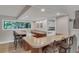 Modern bar area with counter seating, and ample natural light, creating an inviting space for entertaining guests at 624 Maple Oak Cir # 108, Altamonte Springs, FL 32701