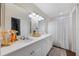 Double vanity bathroom with updated fixtures and flooring at 624 Maple Oak Cir # 108, Altamonte Springs, FL 32701