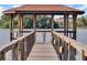 Picturesque dock featuring a covered gazebo, offering a peaceful retreat on the water at 624 Maple Oak Cir # 108, Altamonte Springs, FL 32701