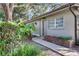 Charming home features a well-maintained exterior with mature landscaping, a brick garden bed, and a sidewalk at 624 Maple Oak Cir # 108, Altamonte Springs, FL 32701
