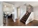 Hallway with dark hardwood floors and staircase leading upstairs at 624 Maple Oak Cir # 108, Altamonte Springs, FL 32701