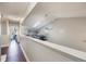 Lofted hallway with wood flooring and access to upper level at 624 Maple Oak Cir # 108, Altamonte Springs, FL 32701