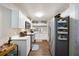 Modern kitchen with white cabinets, stainless steel appliances, and light-colored countertops at 624 Maple Oak Cir # 108, Altamonte Springs, FL 32701