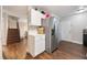 Modern kitchen with white cabinets, stainless steel refrigerator, and wood flooring at 624 Maple Oak Cir # 108, Altamonte Springs, FL 32701