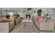 Cozy living room featuring comfortable seating, a stone fireplace, and a neutral color palette creating a welcoming atmosphere at 624 Maple Oak Cir # 108, Altamonte Springs, FL 32701