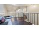 Bright loft overlooks main living area, featuring wood floors at 624 Maple Oak Cir # 108, Altamonte Springs, FL 32701