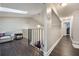 Open loft with wood floors and view of lower level at 624 Maple Oak Cir # 108, Altamonte Springs, FL 32701