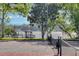 Enjoy a game of tennis on the community court with scenic views of the tranquil lake and gazebo at 624 Maple Oak Cir # 108, Altamonte Springs, FL 32701