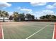 Well-maintained tennis courts with nets, set against a backdrop of trees and a clear blue sky for recreational activities at 624 Maple Oak Cir # 108, Altamonte Springs, FL 32701