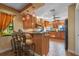 Well-equipped kitchen with wood cabinets and granite countertops at 7743 Lake Ola Dr, Mount Dora, FL 32757