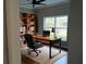 Home office with built-in shelving and large window at 8498 Sw 129Th Terrace Rd, Dunnellon, FL 34432