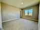 Spacious bedroom with large window and tile flooring at 8592 Hempstead Way, Mount Dora, FL 32757