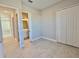 Bright bedroom with double door closet and en-suite bathroom at 8592 Hempstead Way, Mount Dora, FL 32757