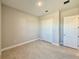 Spacious bedroom with a large closet and tile floors at 8592 Hempstead Way, Mount Dora, FL 32757