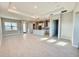 Spacious and bright Gathering room with tile flooring and open concept kitchen at 8592 Hempstead Way, Mount Dora, FL 32757