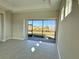 Bright living room with sliding glass doors leading to the backyard at 8592 Hempstead Way, Mount Dora, FL 32757
