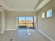 Bright living room with sliding glass doors leading to the backyard at 8592 Hempstead Way, Mount Dora, FL 32757
