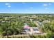 Aerial view shows the home's location surrounded by nature at 91 Locust Loop, Ocala, FL 34472