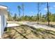 Large backyard features fresh sod and a concrete patio at 91 Locust Loop, Ocala, FL 34472