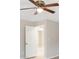 Bedroom with ceiling fan, and doorway to another room at 91 Locust Loop, Ocala, FL 34472