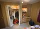 Spacious bedroom closet with ample storage, including drawers and shelving at 975 Cr 461, Lake Panasoffkee, FL 33538