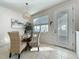 Charming dining area with glass-top table and wicker chairs at 1306 Painted Bunting Ave, Oakland, FL 34787