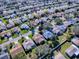 Aerial view of a house and surrounding neighborhood at 16914 Se 96Th Chapelwood Cir, The Villages, FL 32162