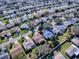 Aerial view of a house and surrounding neighborhood at 16914 Se 96Th Chapelwood Cir, The Villages, FL 32162