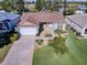 Single-story home with a brick driveway and well-maintained lawn at 16914 Se 96Th Chapelwood Cir, The Villages, FL 32162