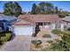 Aerial view of house showing front yard, driveway, and landscaping at 16914 Se 96Th Chapelwood Cir, The Villages, FL 32162