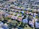 Aerial view of a house and surrounding neighborhood at 16914 Se 96Th Chapelwood Cir, The Villages, FL 32162