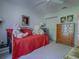 Bedroom with daybed, dresser, and ceiling fan at 16914 Se 96Th Chapelwood Cir, The Villages, FL 32162