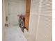 Efficient laundry area featuring washer, dryer, storage cabinets, and utility sink, adding convenience at 16914 Se 96Th Chapelwood Cir, The Villages, FL 32162