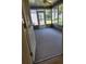Inviting sunroom with tiled flooring and natural light, perfect for relaxing and enjoying outdoor views at 16914 Se 96Th Chapelwood Cir, The Villages, FL 32162