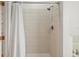 Shower stall with white tile and shower curtain at 221 Brookdale Loop, Clermont, FL 34711