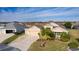 Beautiful home with two-car garage and landscaped yard at 3113 Sweetgum St, The Villages, FL 32163