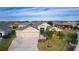 Single-Gathering home with a two-car garage and lush landscaping at 3113 Sweetgum St, The Villages, FL 32163