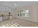 Bedroom with built-in desk and large window with plantation shutters at 3113 Sweetgum St, The Villages, FL 32163
