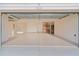Spacious garage with epoxy floor and built-in storage at 3113 Sweetgum St, The Villages, FL 32163