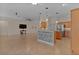 Kitchen with an island, stainless steel appliances, and light wood cabinets at 3113 Sweetgum St, The Villages, FL 32163
