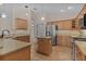 Well-equipped kitchen featuring stainless steel appliances and granite countertops at 3113 Sweetgum St, The Villages, FL 32163
