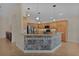 Modern kitchen with stainless steel appliances and a breakfast bar at 3113 Sweetgum St, The Villages, FL 32163