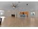 Open concept living and kitchen area with tile floors and high ceilings at 3113 Sweetgum St, The Villages, FL 32163