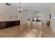Open living area with tile floors and access to the lanai at 3113 Sweetgum St, The Villages, FL 32163