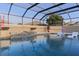 Lush pool with patio, fire pit, and comfortable lounge chairs at 3113 Sweetgum St, The Villages, FL 32163