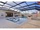 Luxury pool with covered patio, fire pit, and outdoor seating at 3113 Sweetgum St, The Villages, FL 32163